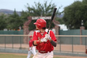 Lightning strikes, Cowboys win fourth in a row 9-5 over Pupfish Austin Prott right before he hit his home-run. Prott was announced as the MVP of the game. (Courier: Photo: Bryon Garrison)